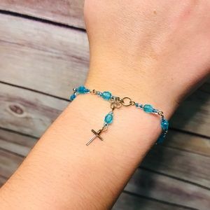 Blue beaded bracelet with cross